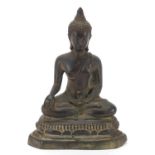 Burmese patinated bronze figure of seated Buddha, 20.5cm high