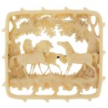 Ivory brooch carved with three horses under trees, 5cm x 4.5cm, 9.8g