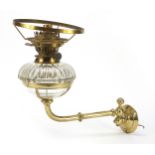 Antique brass and glass converted oil lamp to electricity by Hicks & Son, wall mounted on a swinging