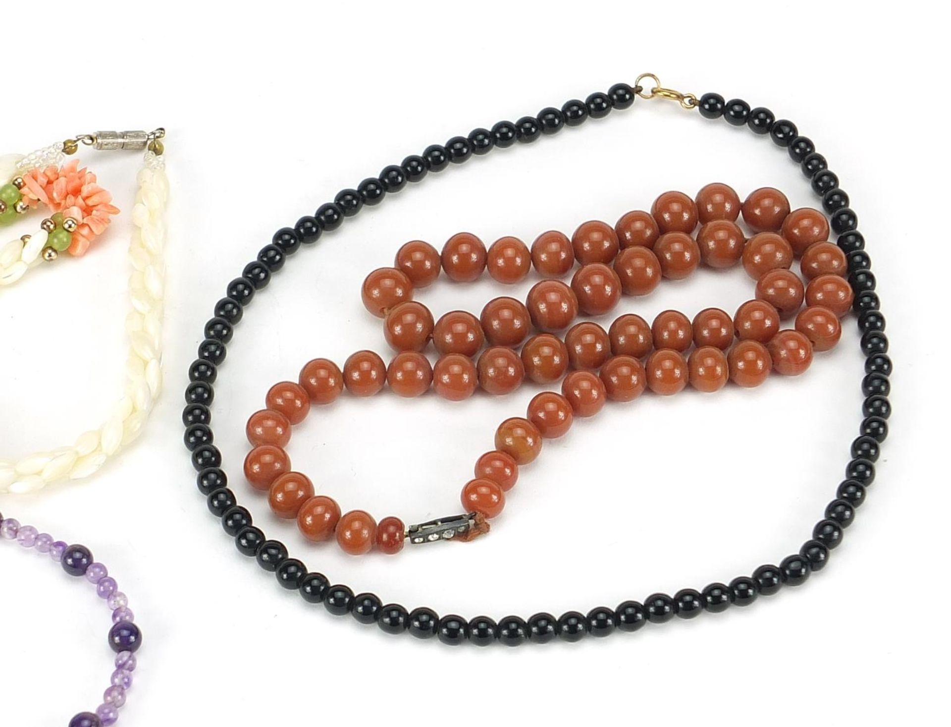 Four necklaces and an amethyst bracelet with 9ct gold clasp including goldstone and carnelian with - Image 3 of 6