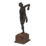 Antique cast metal figure of a nude female raised on a rectangular base with tooled leather