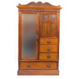 Edwardian carved walnut wardrobe with mirrored door, fielded panel door and four drawers, 220cm H