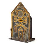 19th century brass money bank in the form of a building with two lanterns to the exterior, 18cm high