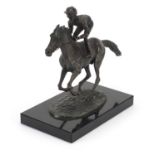 David Cornell 1985, patinated bronze study of a jockey on horseback titled Champion Finish, raised