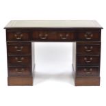 Mahogany twin pedestal desk with tooled green leather insert, 77cm H x 121cm W x 60cm D