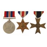 Two British military World War II medals and a German example