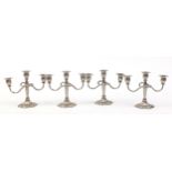 Two pairs of three branch candelabras, 21cm high