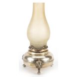 Unmarked silver oil lamp with three lion supports and frosted glass shade, impressed Plata to the