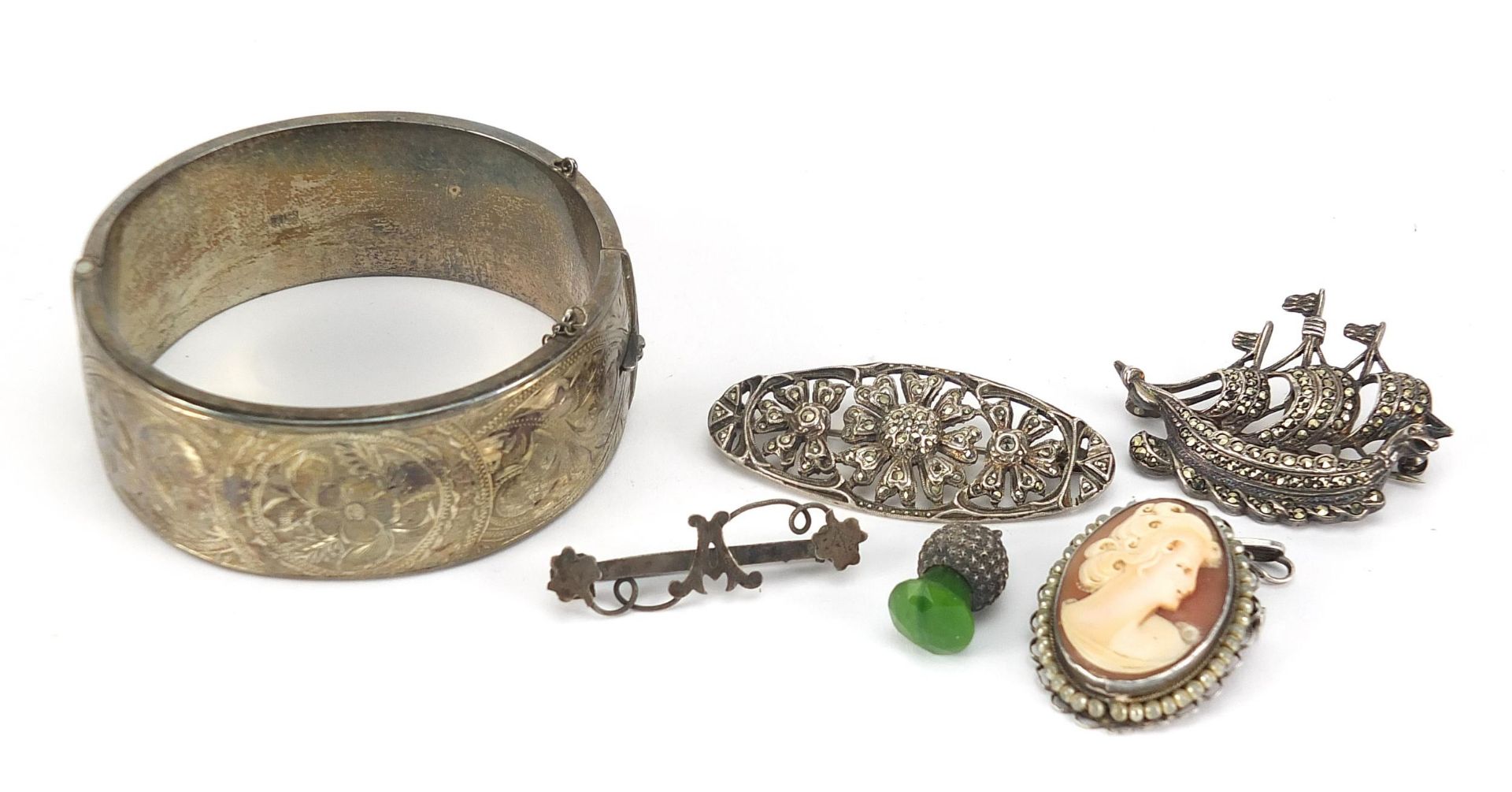 Silver jewellery including a large Victorian style hinged bangle and marcasite brooches, 71.5g