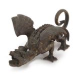 Partially gilt patinated bronze mythical dragon, 11cm in length