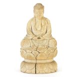 Chinese ivory carving of seated Buddha, character marks to the base, 11cm high