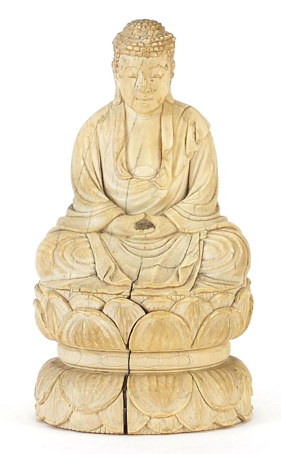Chinese ivory carving of seated Buddha, character marks to the base, 11cm high