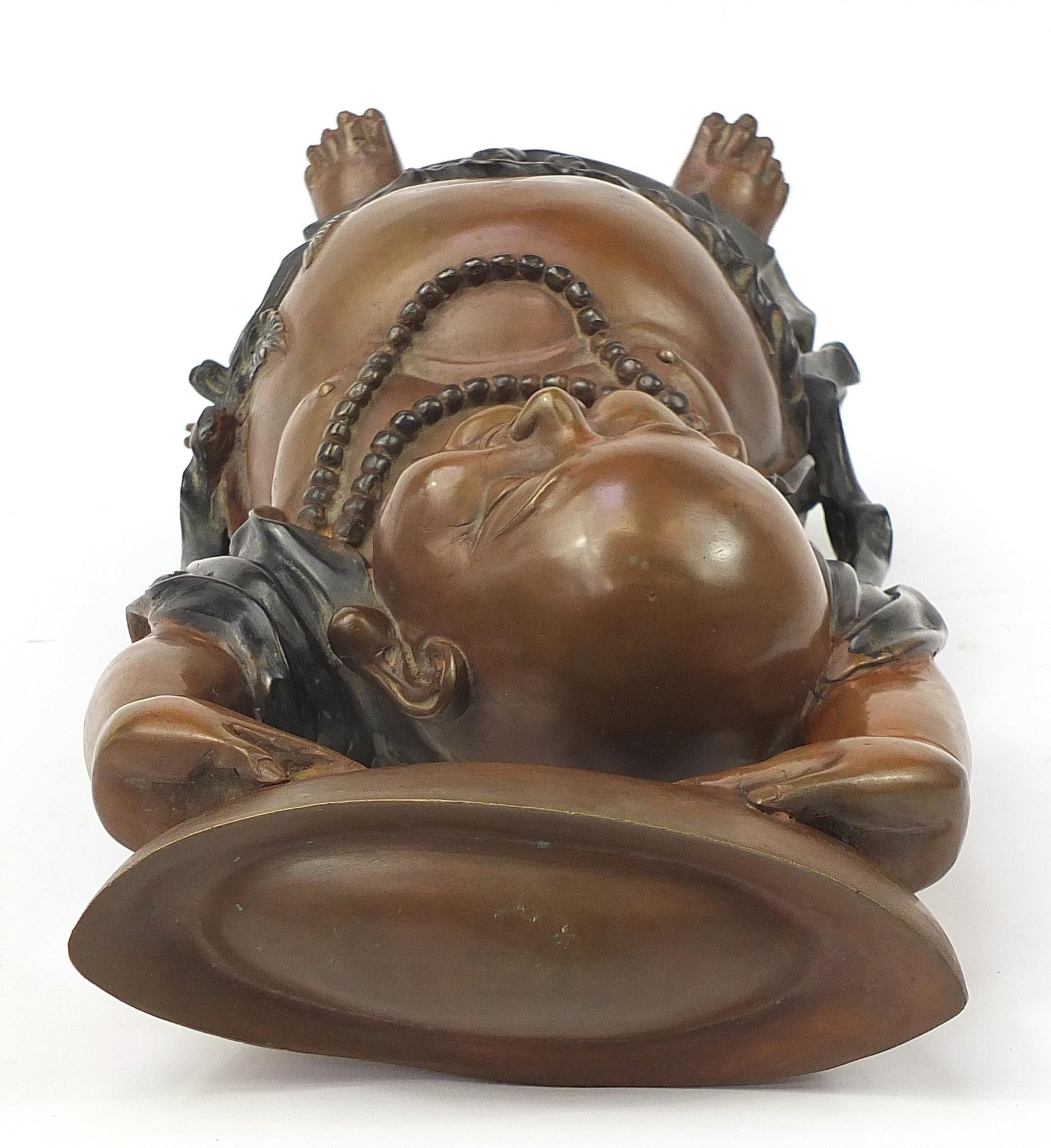 Large Chinese patinated bronze figure of Buddha with his hands above his head holding a vessel, 48cm - Image 5 of 6