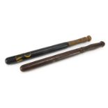 Two antique police truncheons comprising one with rotating handle and one with painted initials WPC,