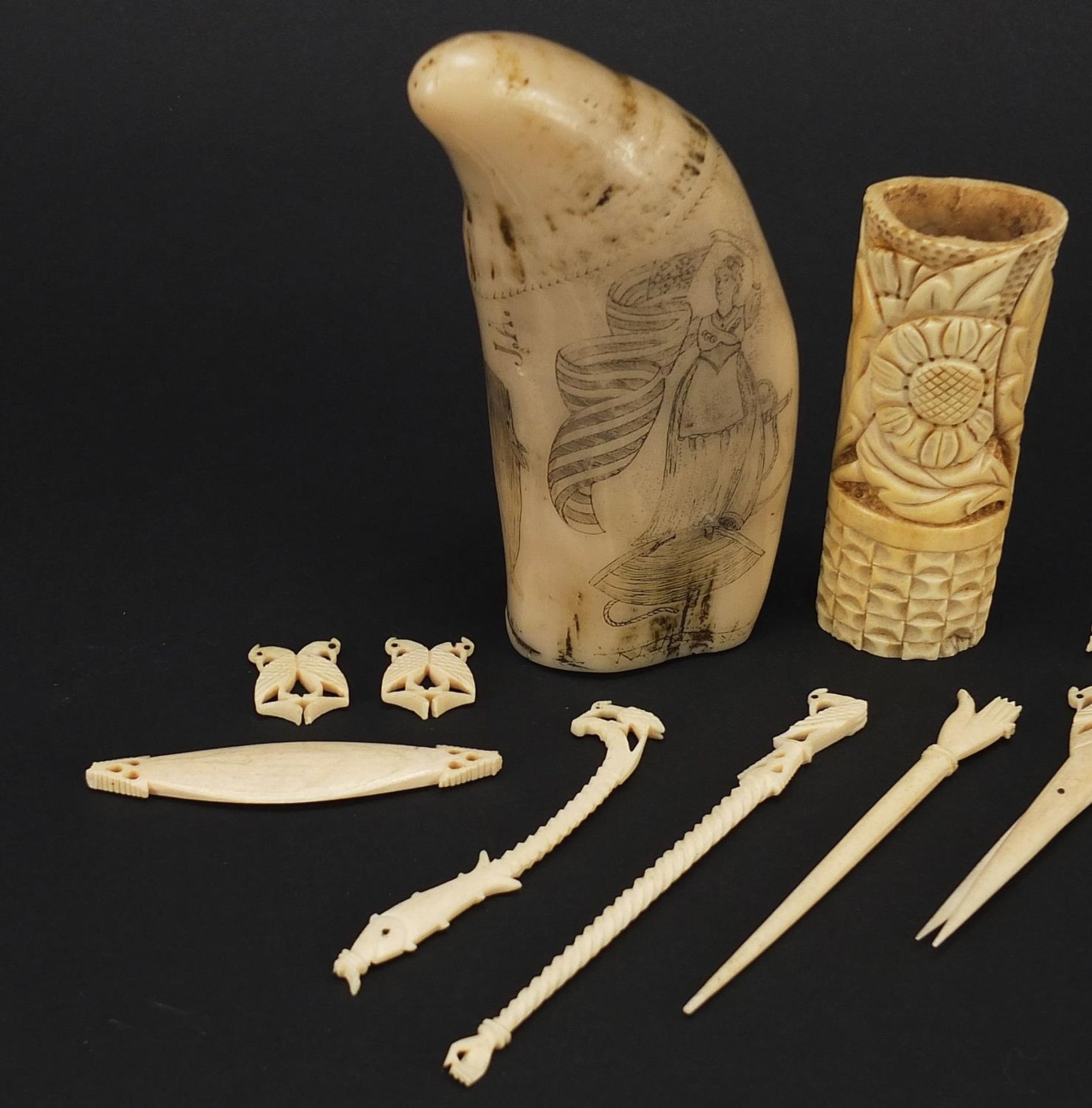 Ivory and bone objects including scrimshaw, the largest 13cm in length - Image 2 of 4