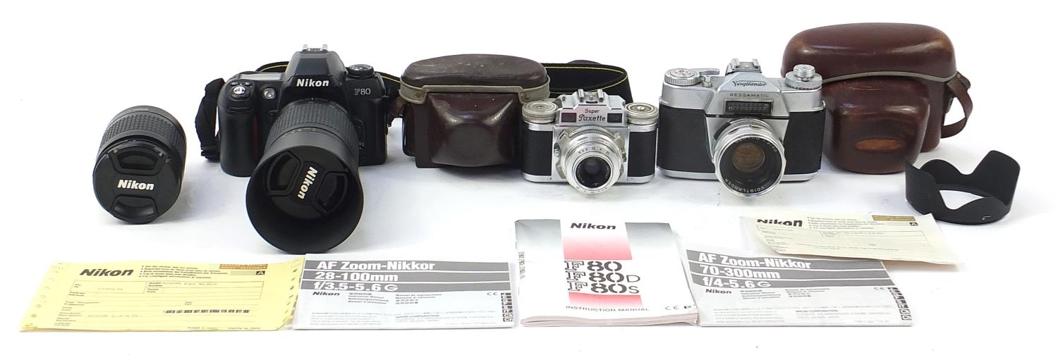 Cameras including Voigtlander Super pack set and Nikon with lenses