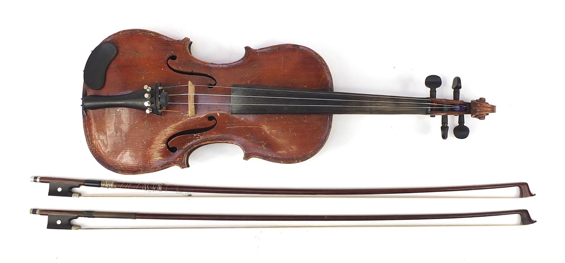 Old wooden violin with two bows and protective case, the violin back 14 inches in length, one violin