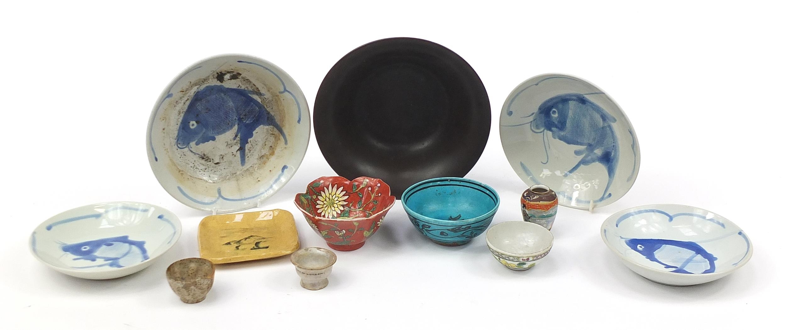 Chinese, Japanese and Persian ceramics including a blue glazed bowl hand painted with fish, the