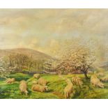 Sheep grazing before blossom trees and mountains, oil on canvas, signed E J Dean, mounted and