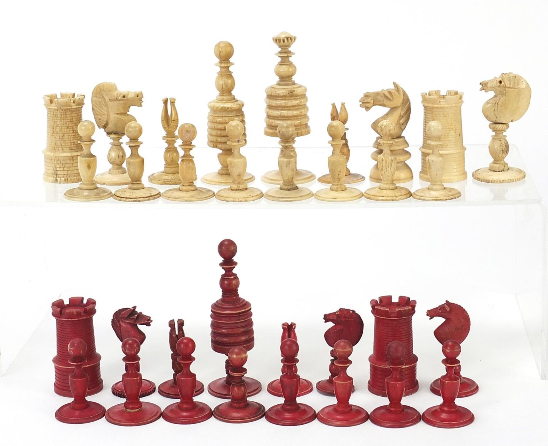 Half stained carved bone chess set and a mahogany case, the largest chess pieces 8.5cm high - Image 2 of 7