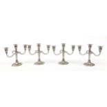 Two pairs of three branch candelabras, 21cm high