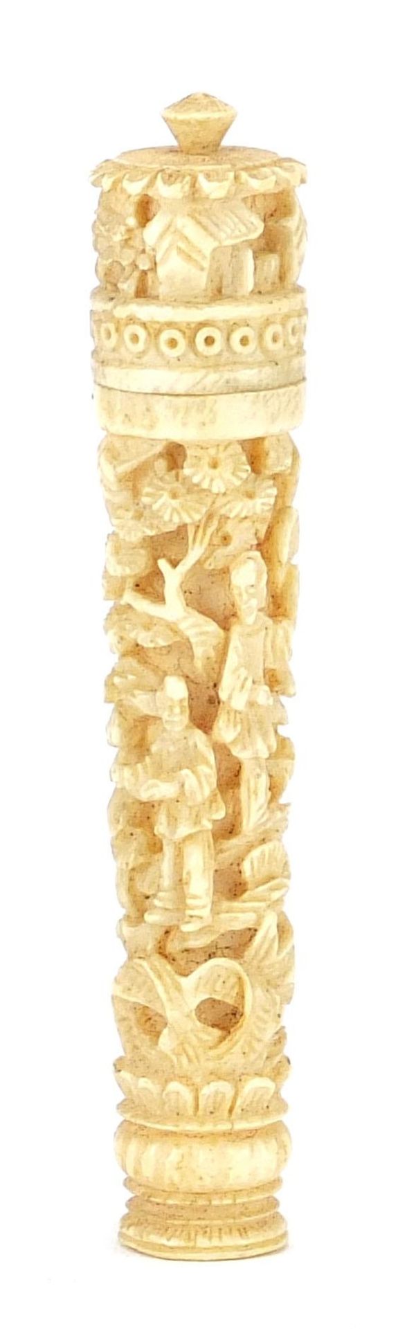 Chinese carved ivory needle case carved with figures amongst foliage and trees, housed in a