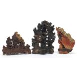 Three Chinese soapstone landscape carvings including one of two immortals amongst clouds, the
