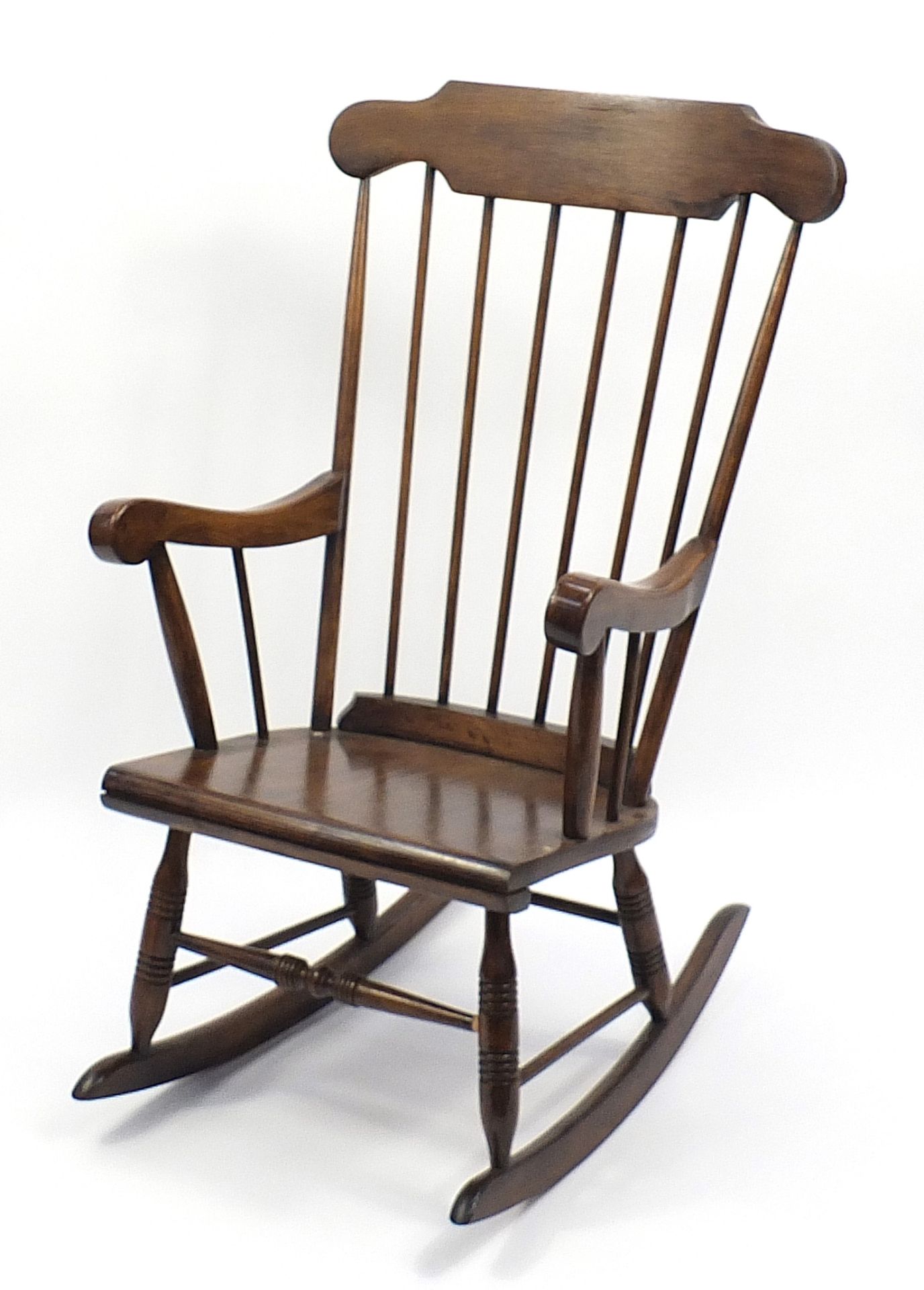Stained wood stick back rocking chair, 105cm high