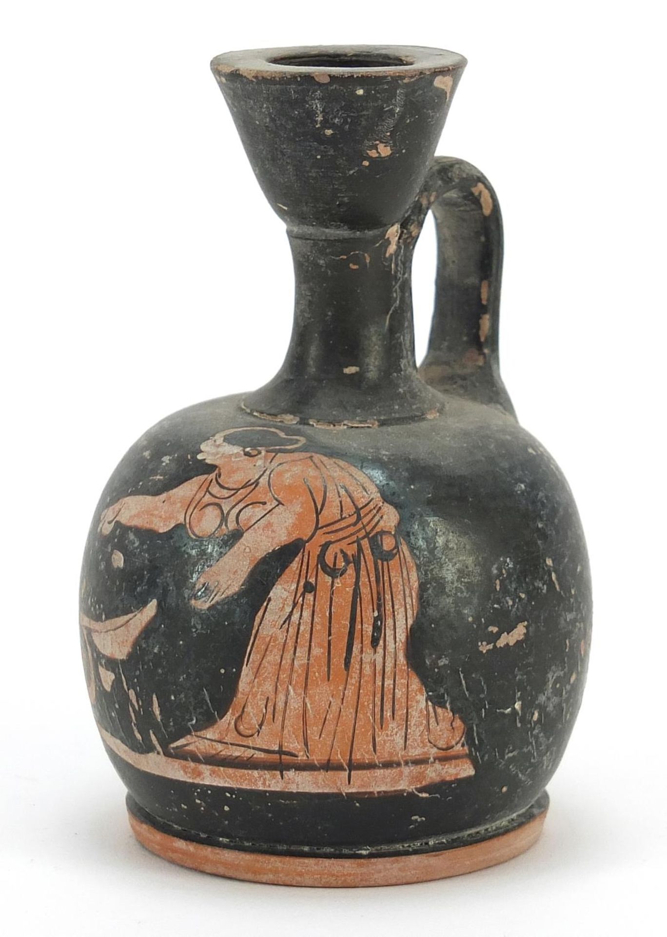Attic pottery squatted lekythos hand painted with a red figure of a woman bending over a wool