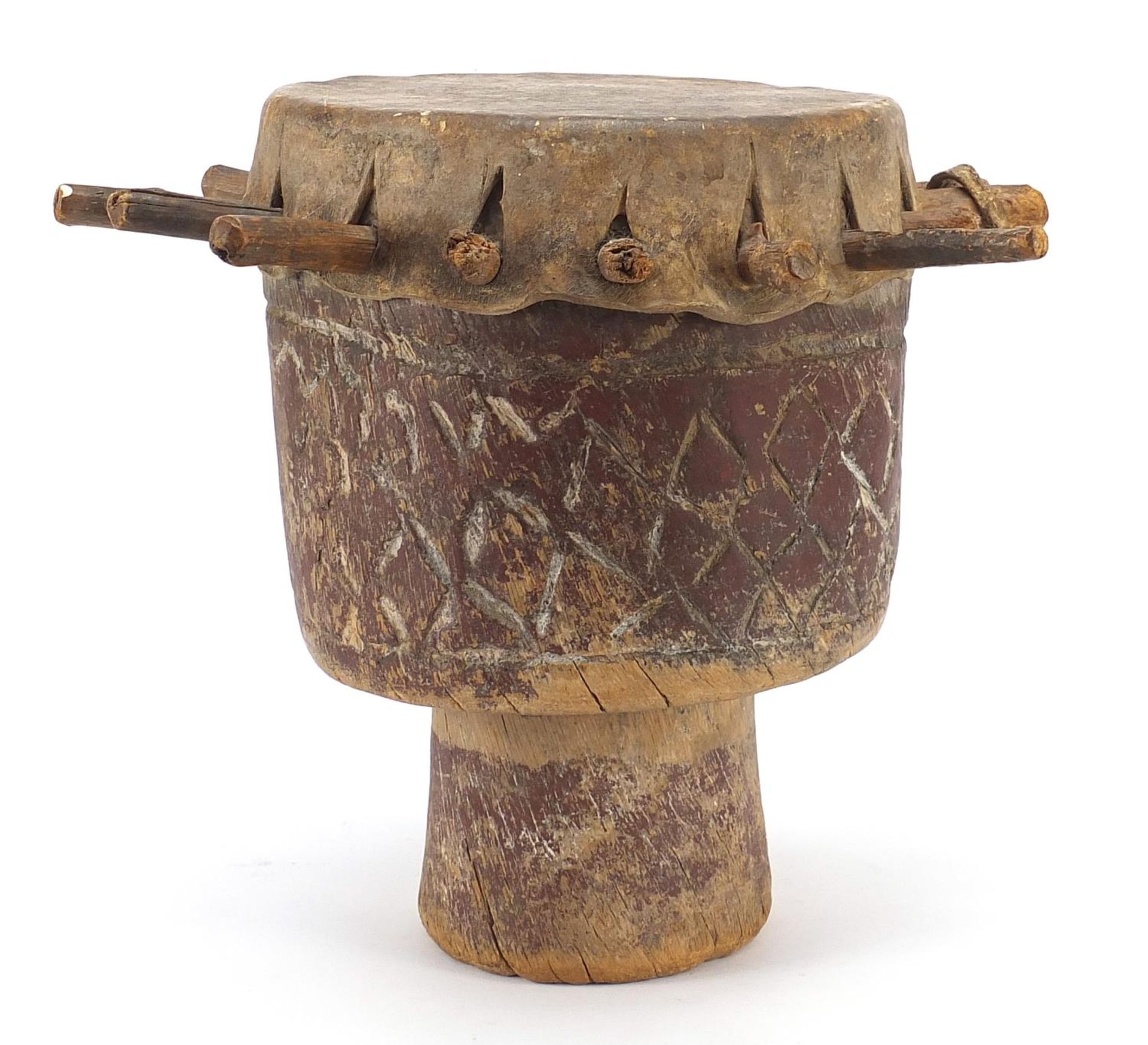 Tribal interest drum carved with geometric motifs, 29cm high