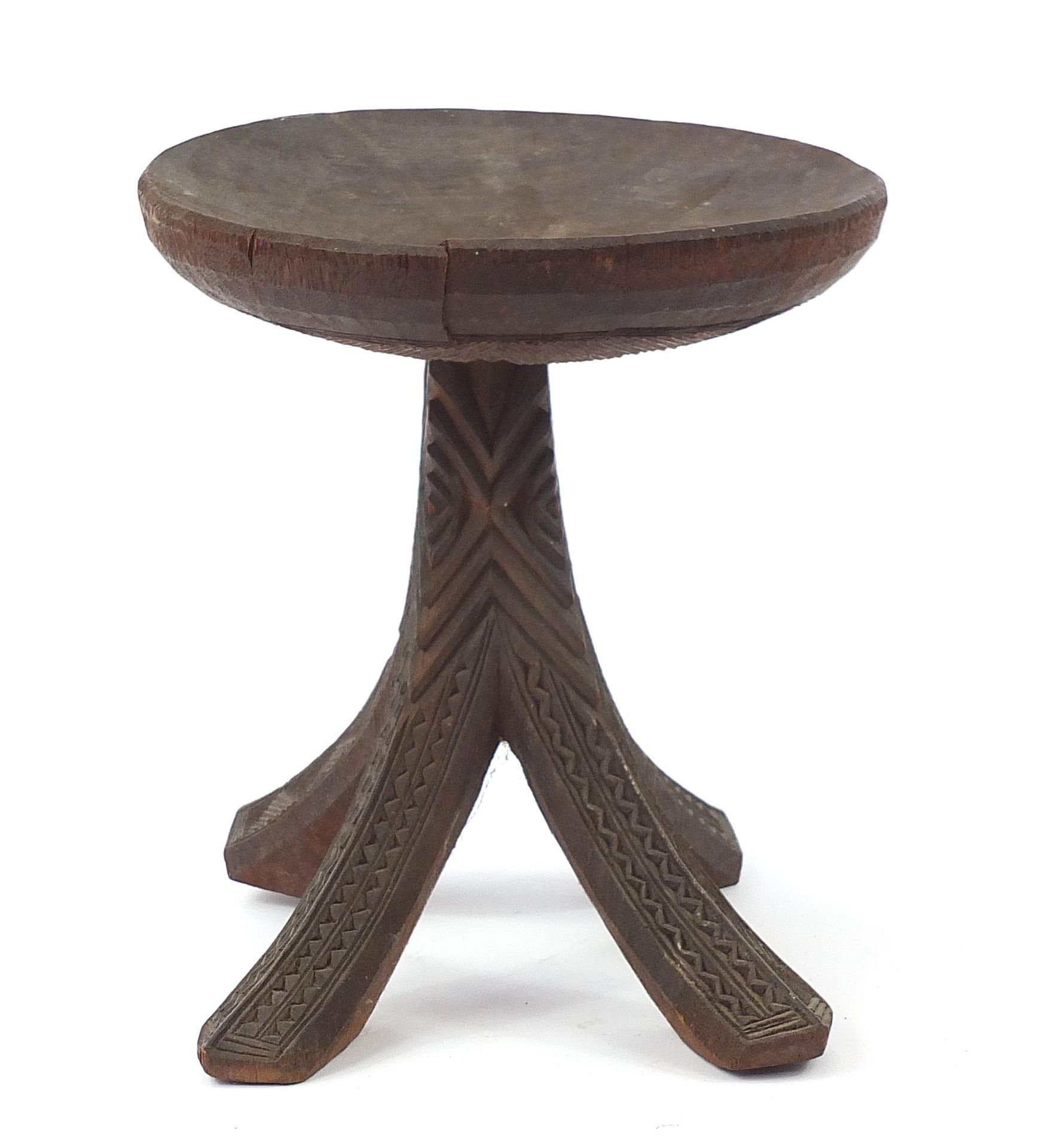 African tribal interest carved stool, 34cm high x 31cm in diameter