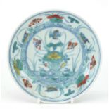 Chinese porcelain doucai dish hand painted with ducks amongst aquatic life, six figure character