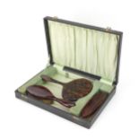 Vintage boxed faux tortoiseshell brush set comprising hand mirror, hairbrush and clothes brush,