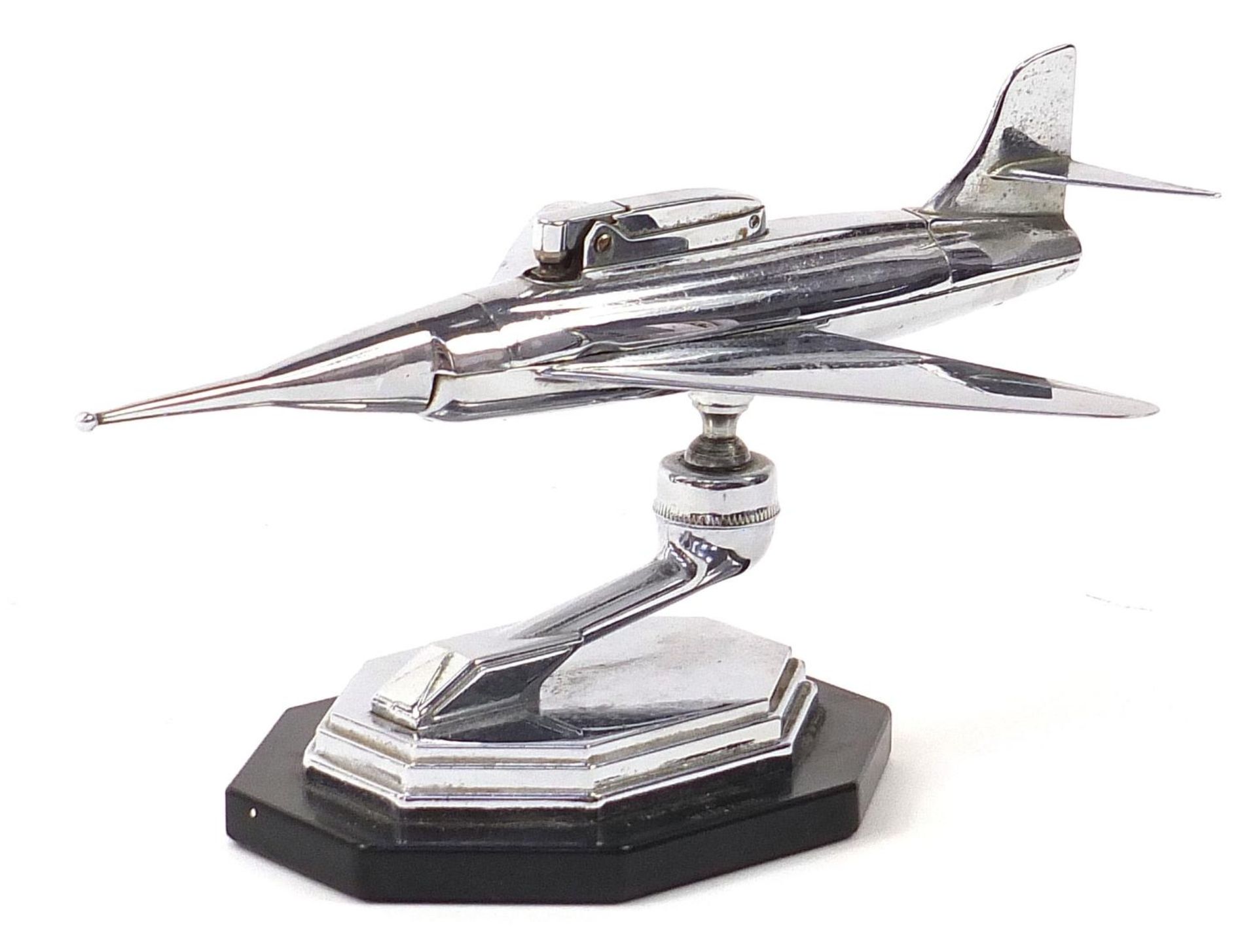 Vintage chrome plated table lighter in the form of a jet aircraft, 24cm in length