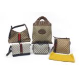 Five ladies Gucci monogrammed bags, the largest 45cm high