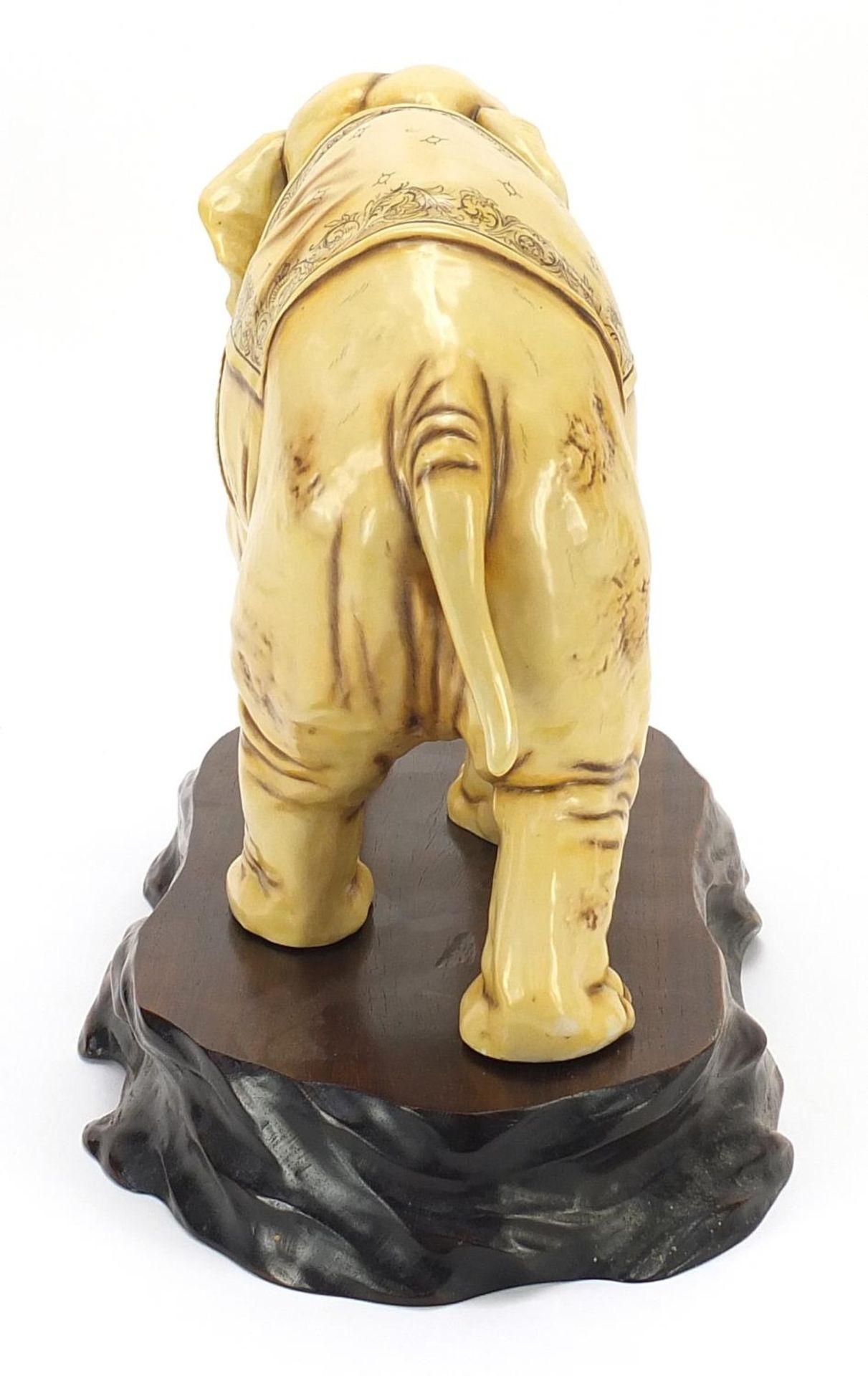 Ivory coloured porcelain model of an elephant on wooden stand, blue anchor mark under one foot, - Image 4 of 11