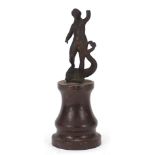 Antique patinated bronze figure of a nude female upon a dolphin, raised on a marble base, possibly