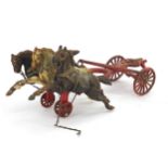 Vintage metal chariot being pulled by three horses, 36cm in length