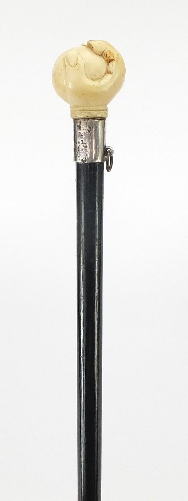 Ebony walking stick with carved silver pommel being in the form of a hand holding a ball, 90cm in - Image 2 of 8