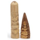 Two carved wood totems, the largest 30cm high