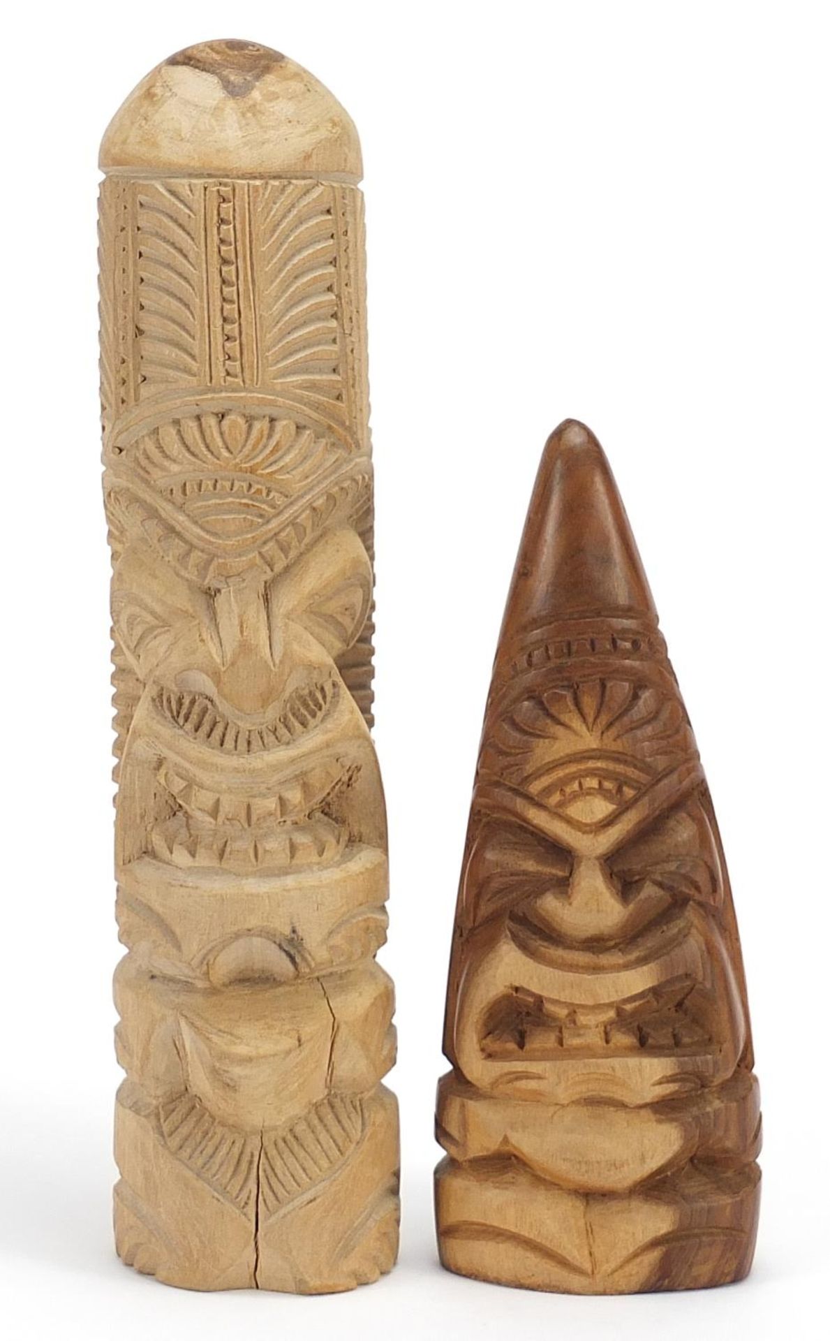 Two carved wood totems, the largest 30cm high