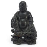 Chino Tibetan patinated bronze figure of Buddha sitting on a carved hardwood base, 18cm high