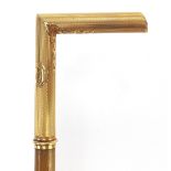 Rhinoceros horn walking stick with unmarked 18ct gold mounts, 78cm in length