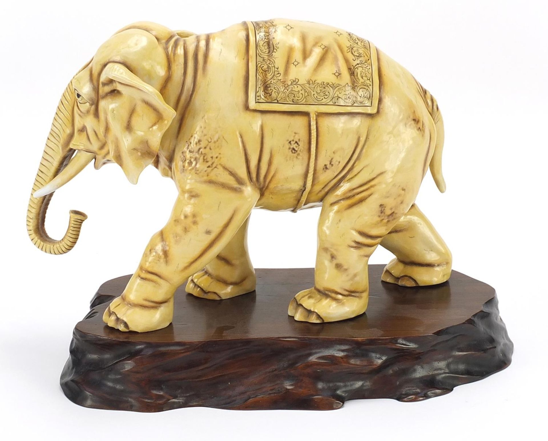 Ivory coloured porcelain model of an elephant on wooden stand, blue anchor mark under one foot, - Image 3 of 11