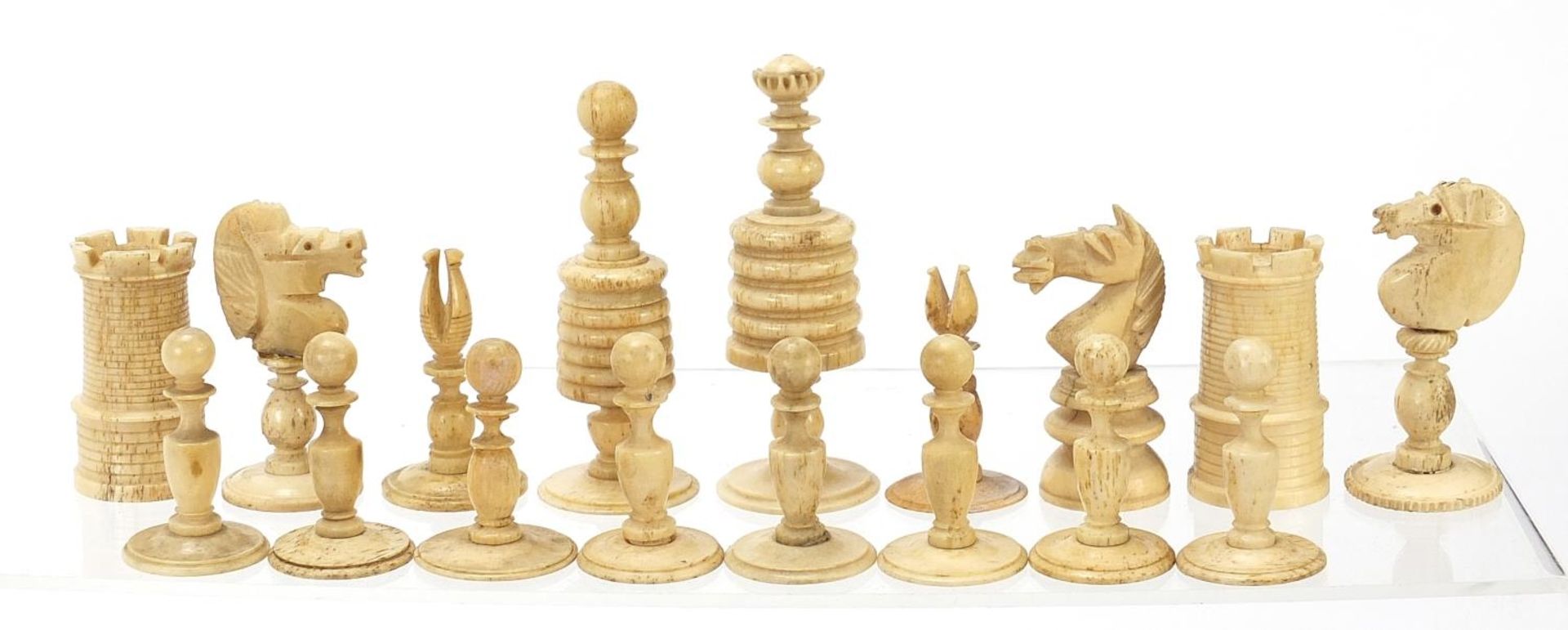 Half stained carved bone chess set and a mahogany case, the largest chess pieces 8.5cm high - Image 3 of 7