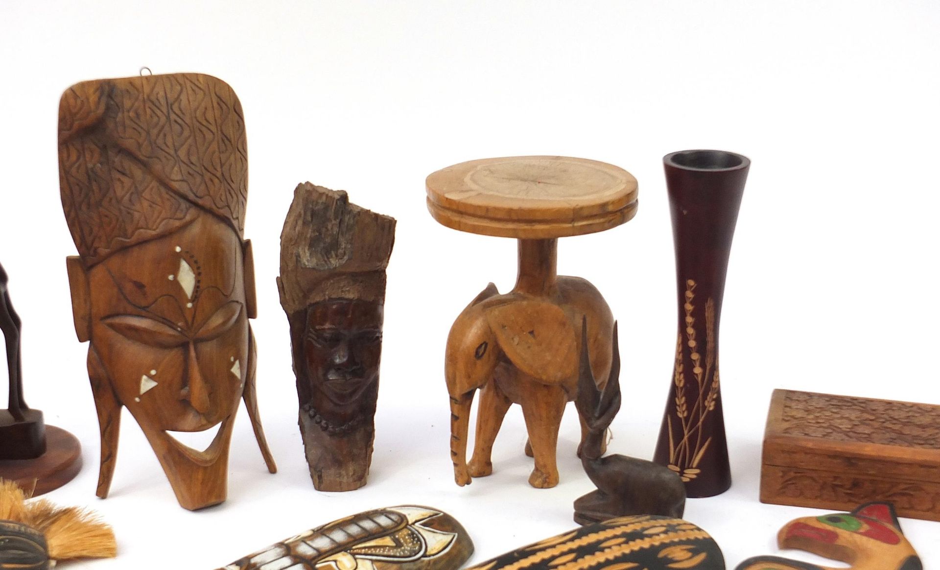 Tribal wood carvings to include African face masks, stool, giraffe bookends, carved box, the largest - Image 3 of 5