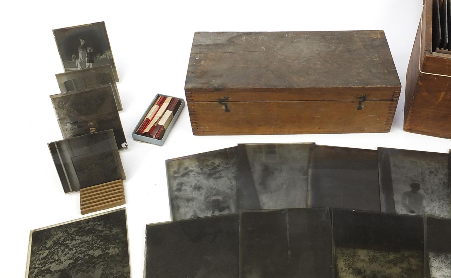 Collection of 19th century social history black and white glass slides arranged in two cases - Image 2 of 12