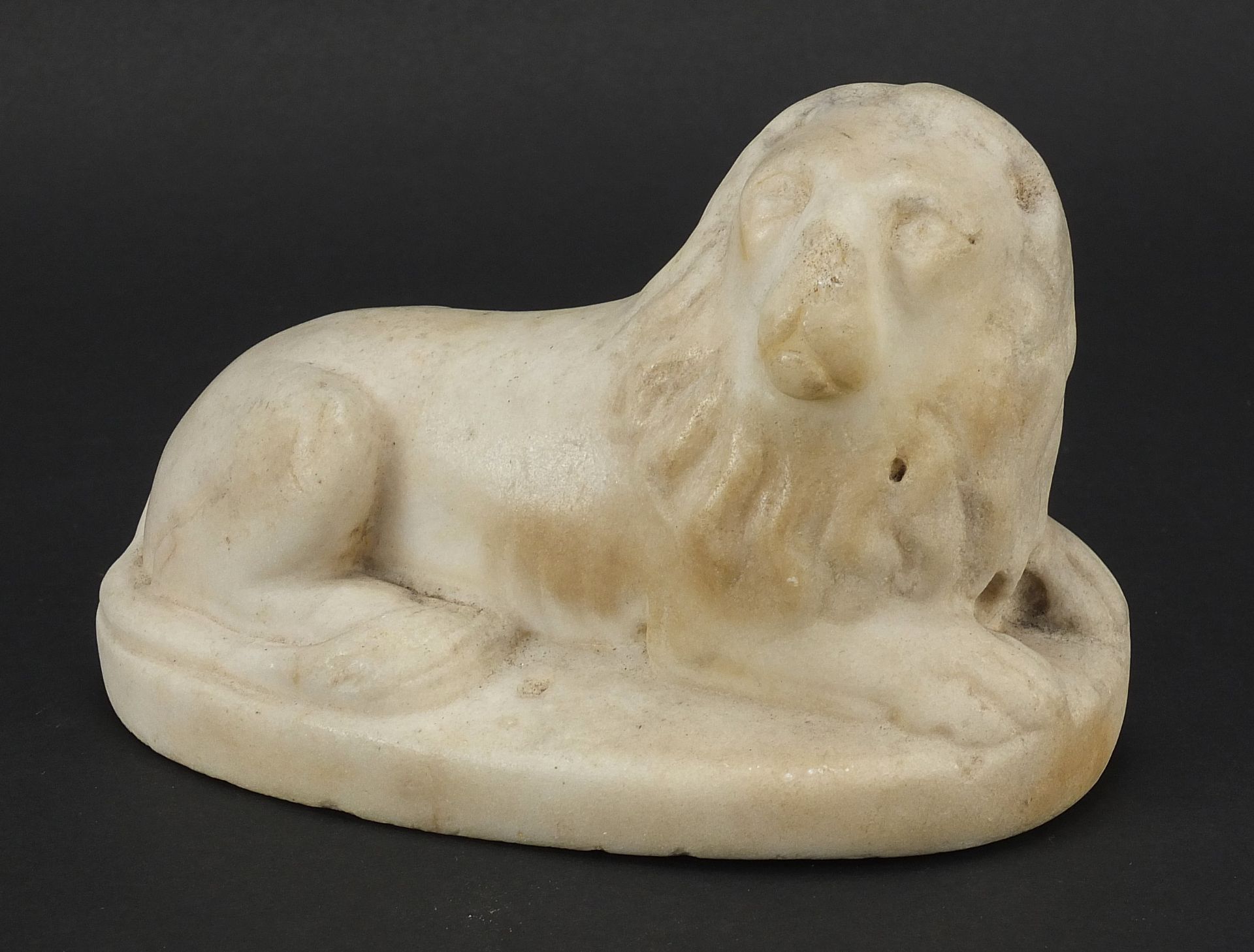 Antique white marble carving of a lion, possibly Roman or Greek, 14.5cm wide