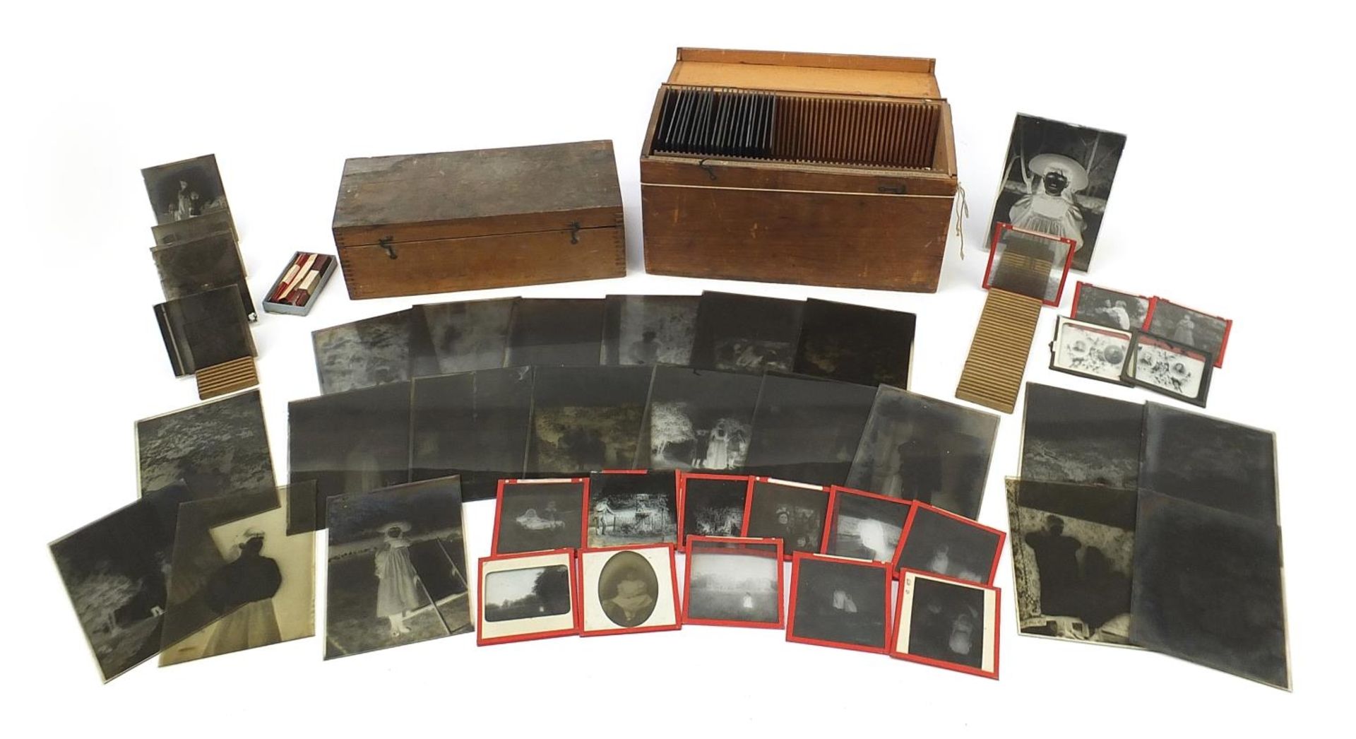 Collection of 19th century social history black and white glass slides arranged in two cases