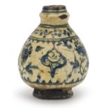 Asian pottery baluster vase decorated in blue and white with black banding and flowers, possibly